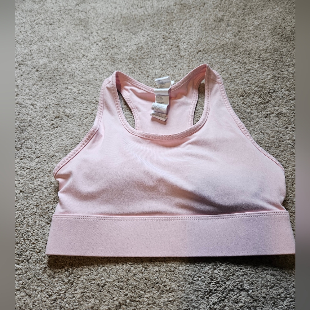 Fabletics On The Go sports bra with back pocket medium impact baby pink
